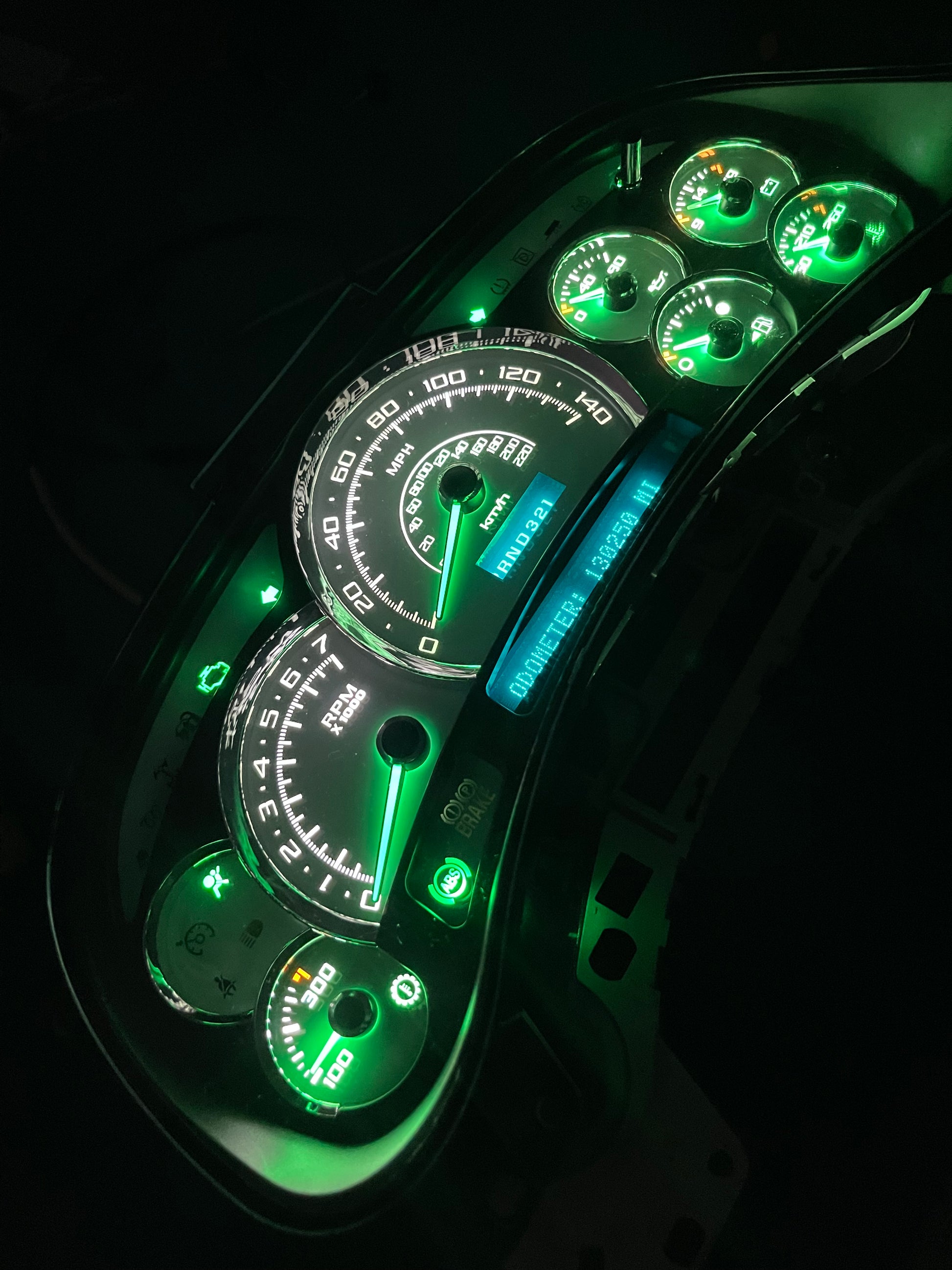 2003-2007 140 MPH 7 Green GLOW NEEDLES Gmc Chevrolet OEM Rebuilt Refurbished Instrument Gauge Cluster Cadillac Escalade , Silverado, Sierra, Tahoe, Denali Suburban, Avalanche, Yukon , W/ Trans Temp (Gold Cadillac Escalade Bezel W/Blue Signals) Speedometer - Speedometerking.com