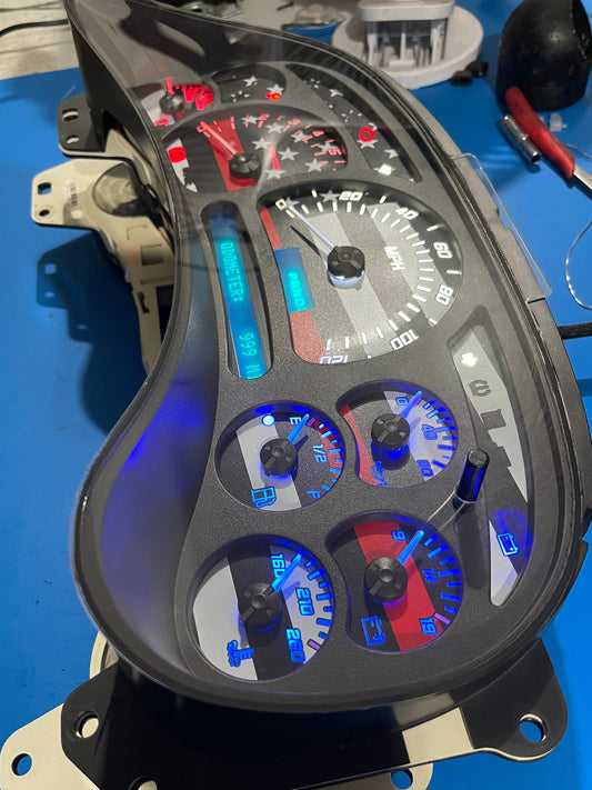 2003-2007 AMERICAN FLAG 7 GLOW NEEDLES Gmc Chevrolet OEM Rebuilt Refurbished Instrument Gauge Cluster Cadillac Escalade , Silverado, Sierra, Tahoe, Denali Suburban, Avalanche, Yukon , W/ Trans Temp (Gold Cadillac Escalade Bezel W/Blue Signals) Speedometer - Speedometerking.com