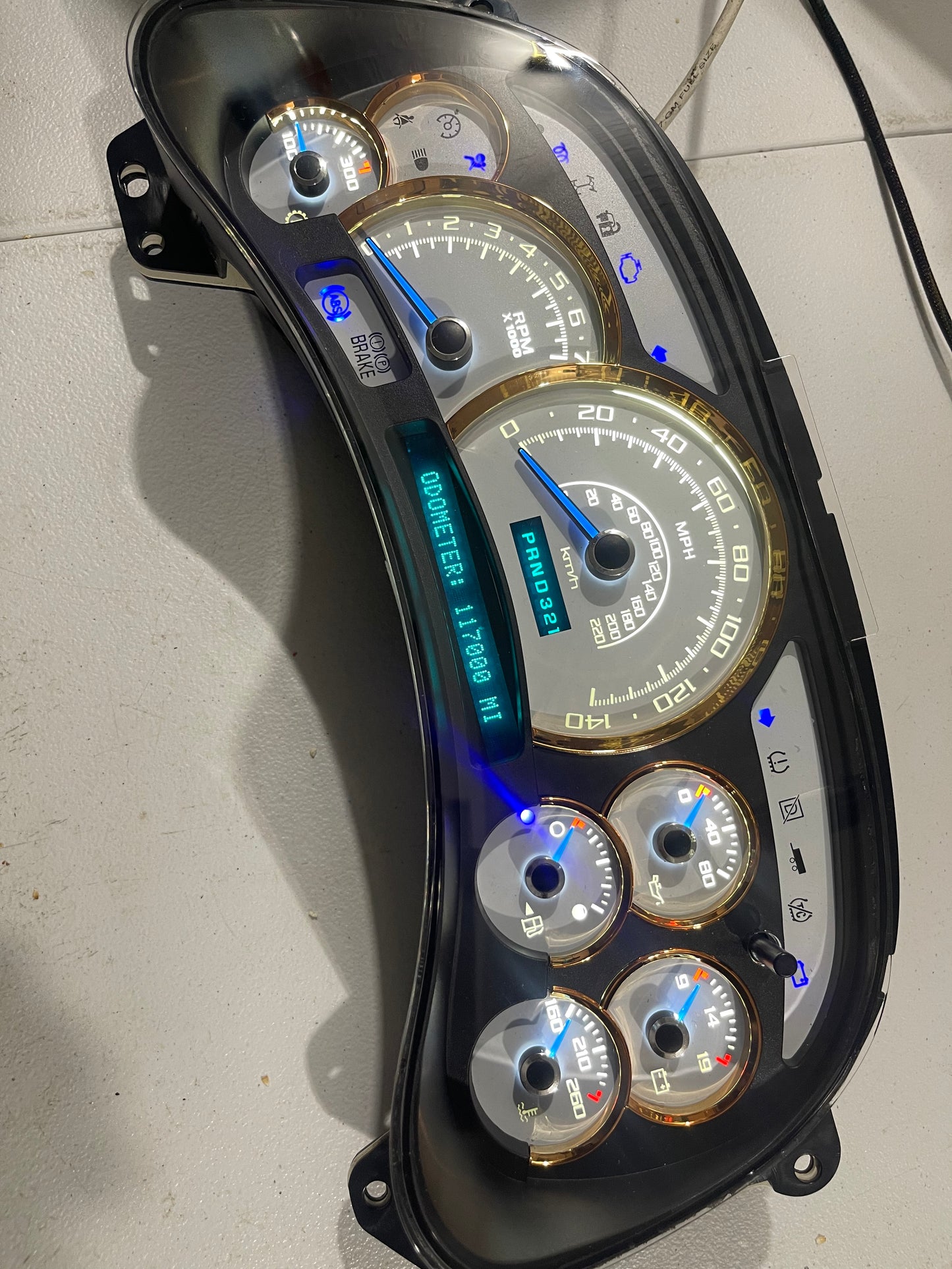 2003-2007 140 MPH 7 GLOW NEEDLES Gmc Chevrolet OEM Rebuilt Refurbished Instrument Gauge Cluster Cadillac Escalade , Silverado, Sierra, Tahoe, Denali Suburban, Avalanche, Yukon , W/ Trans Temp (Gold Cadillac Escalade Bezel W/Blue Signals) Speedometer