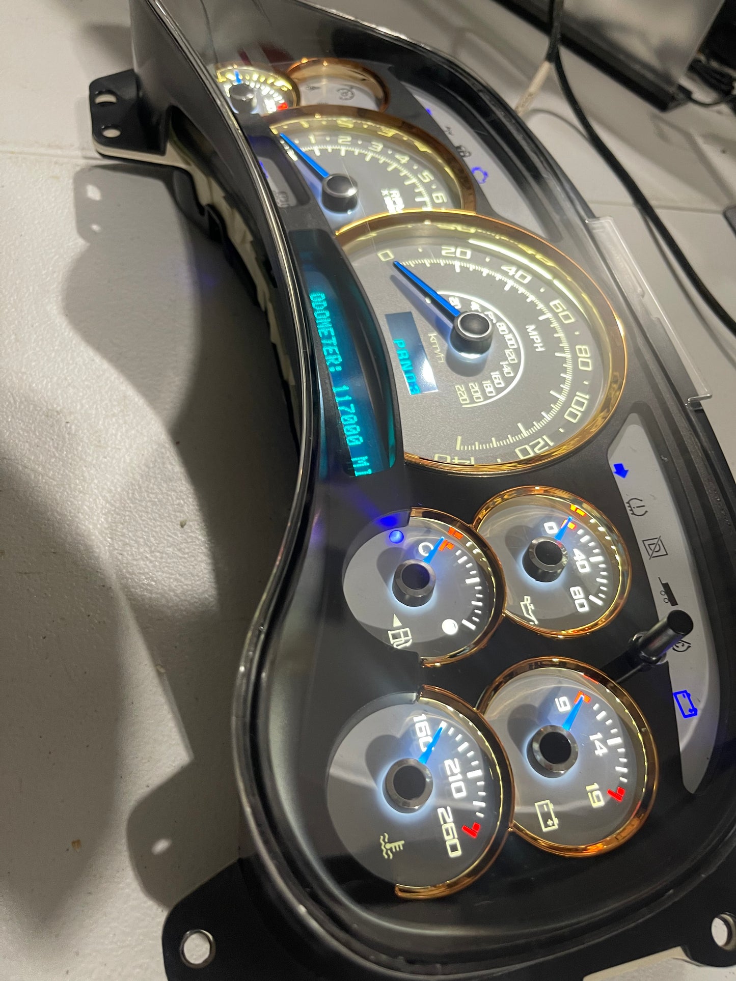 2003-2007 140 MPH 7 GLOW NEEDLES Gmc Chevrolet OEM Rebuilt Refurbished Instrument Gauge Cluster Cadillac Escalade , Silverado, Sierra, Tahoe, Denali Suburban, Avalanche, Yukon , W/ Trans Temp (Gold Cadillac Escalade Bezel W/Blue Signals) Speedometer